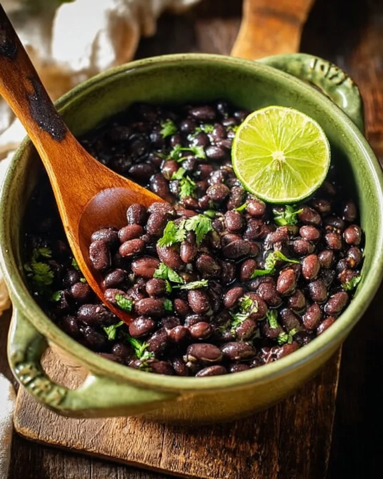 A bowl of seasoned black beans ready for a delicious meal.