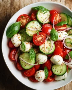 Juicy Cucumber Caprese Salad with fresh tomatoes, mozzarella, and basil